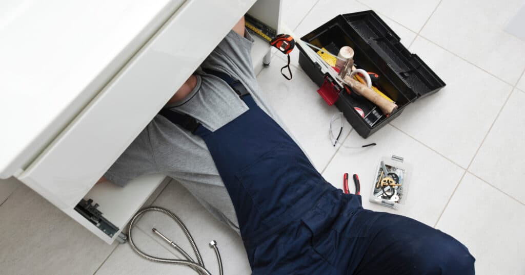plumber under sink