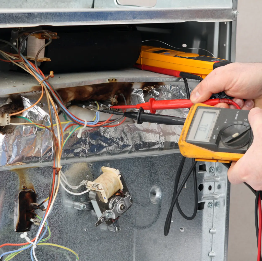 technician repairing an appliance