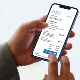 Person checking an invoice in the mobile version of Kickserv