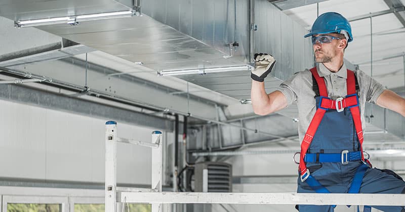HVAC technician doing inspection